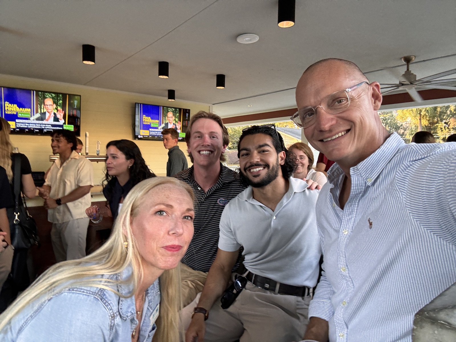 Founding Blue team and attendees connecting after the event
